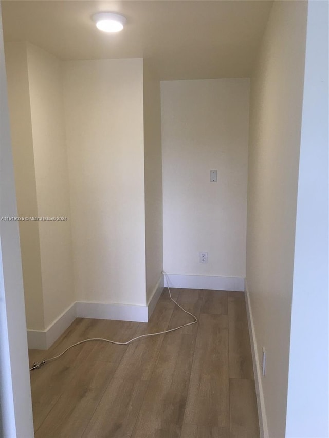 unfurnished room with hardwood / wood-style flooring