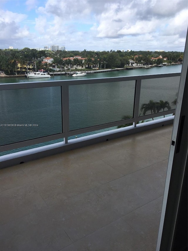 balcony featuring a water view