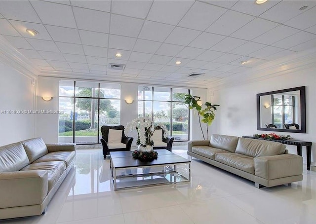 tiled living room featuring ornamental molding and a wall of windows