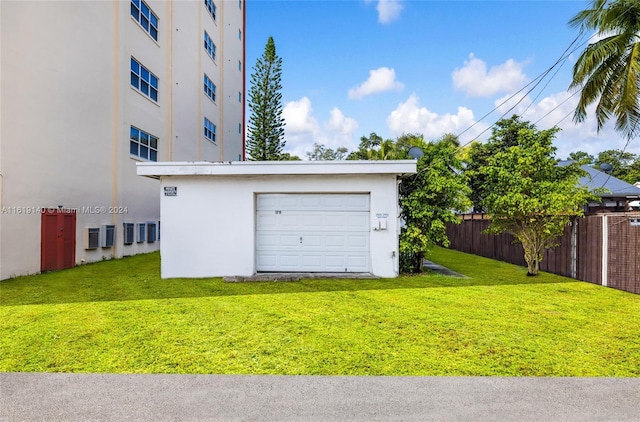 garage with a yard