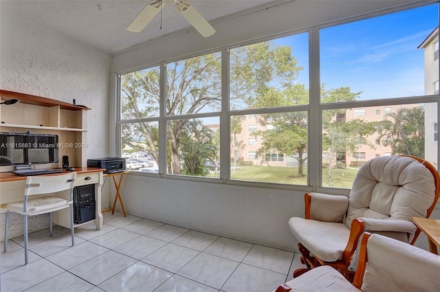 office area featuring ceiling fan, a healthy amount of sunlight, and light tile patterned floors