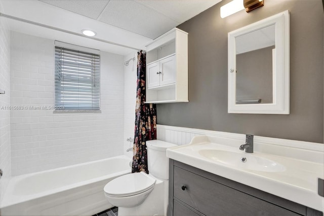 full bathroom with toilet, shower / bathtub combination with curtain, and vanity