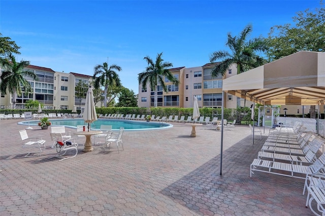 view of swimming pool with a patio