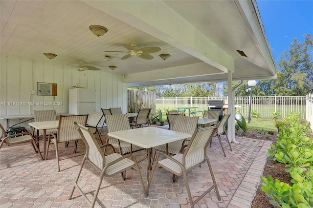 view of patio featuring ceiling fan