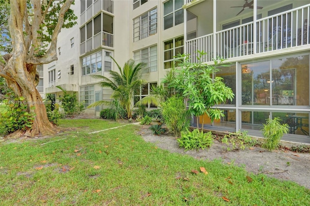 view of home's community featuring a lawn