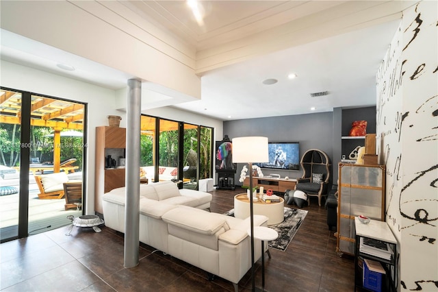 living room featuring ornate columns