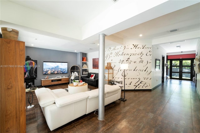 living room featuring ornate columns