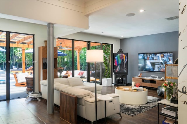 living room with a wealth of natural light and hardwood / wood-style floors