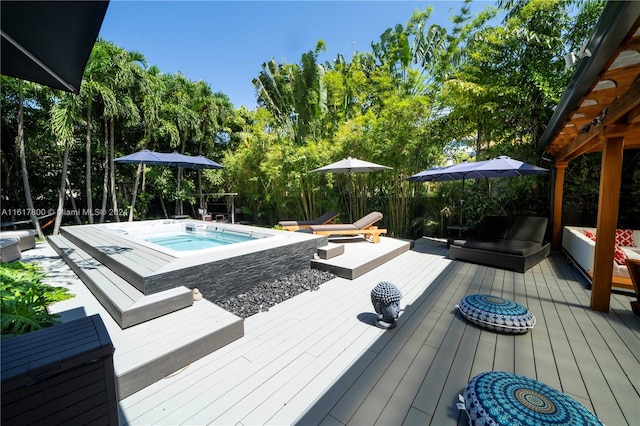 wooden deck with an outdoor fire pit