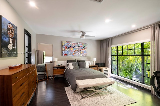 bedroom featuring dark wood-type flooring and ceiling fan