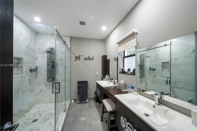 bathroom with vanity and a shower with shower door