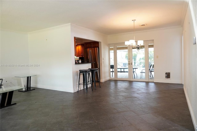 unfurnished dining area with french doors, ornamental molding, and a notable chandelier