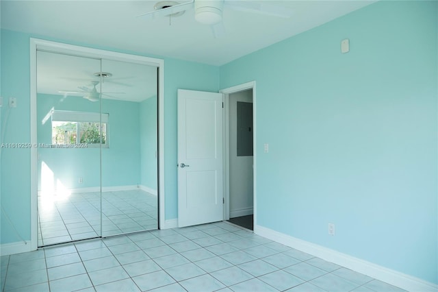 unfurnished room with ceiling fan and light tile patterned floors