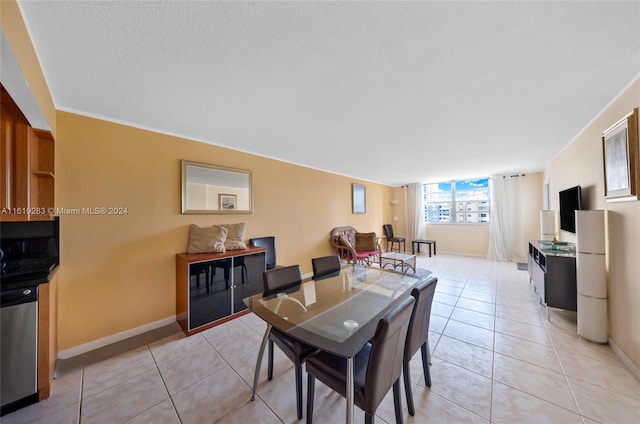 dining area with light tile patterned floors