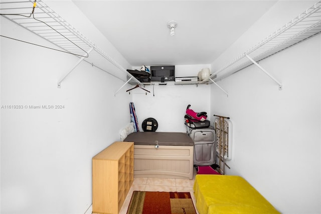 spacious closet with tile patterned floors