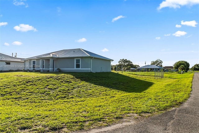 view of home's exterior with a lawn