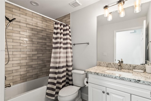 full bathroom with vanity, toilet, and shower / tub combo