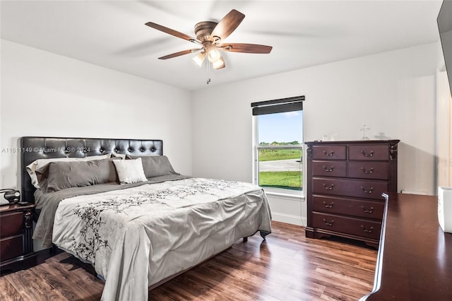 bedroom featuring wood-type flooring and ceiling fan