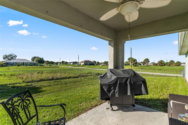 exterior space featuring area for grilling and ceiling fan