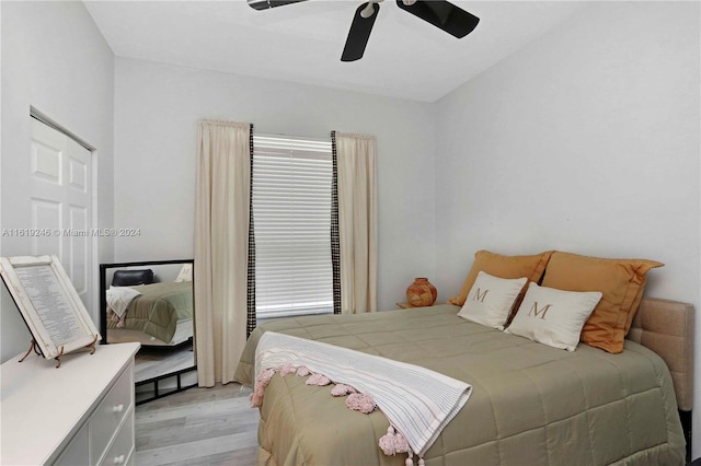 bedroom with light wood-type flooring and ceiling fan