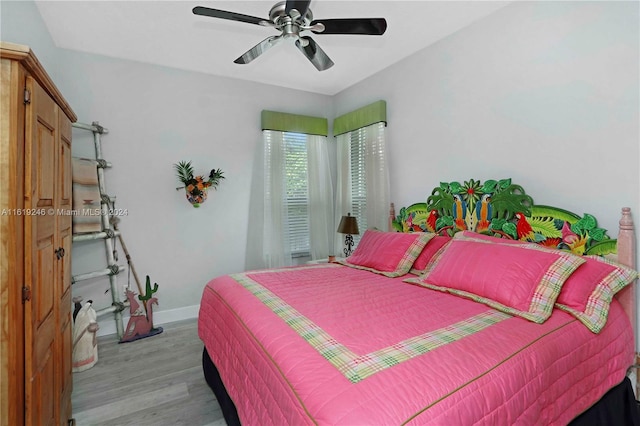 bedroom featuring light wood-type flooring and ceiling fan