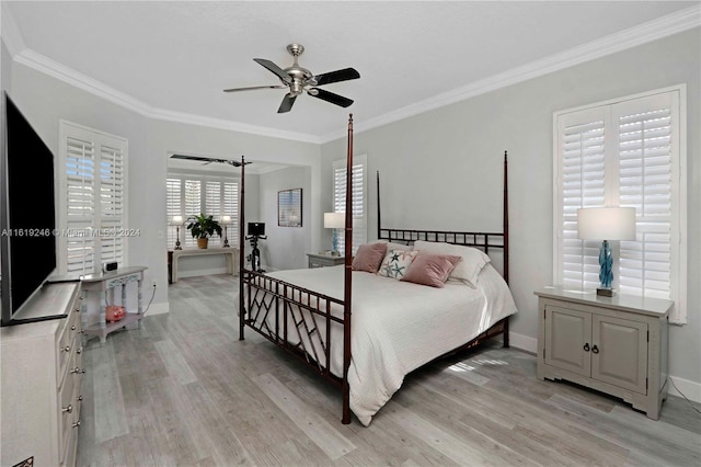 bedroom featuring ceiling fan, light wood-type flooring, and crown molding