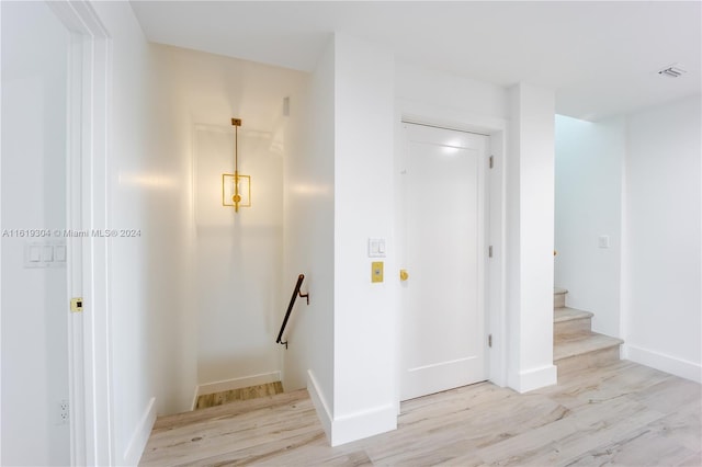 stairs featuring hardwood / wood-style flooring