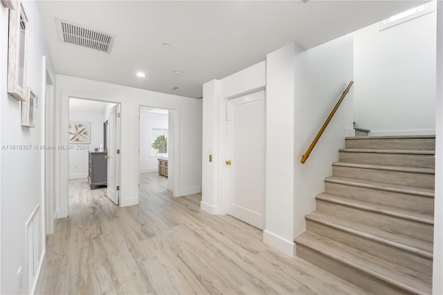 hall with light hardwood / wood-style flooring