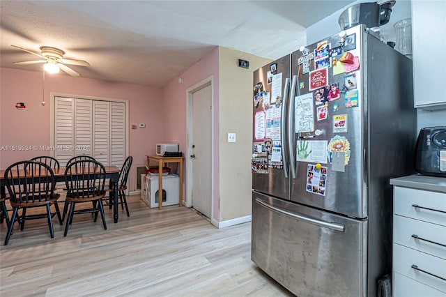 3991 NW 108th Ave, Coral Springs, FL 33065 - kitchen featuring freestanding refrigerator, ceiling fan, light wood-type flooring, baseboards, and white microwave