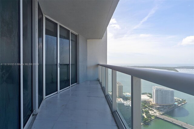 balcony featuring a water view