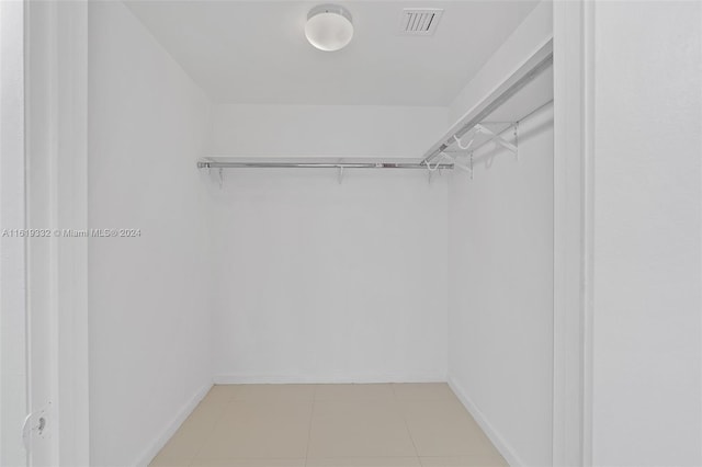 spacious closet featuring tile patterned floors