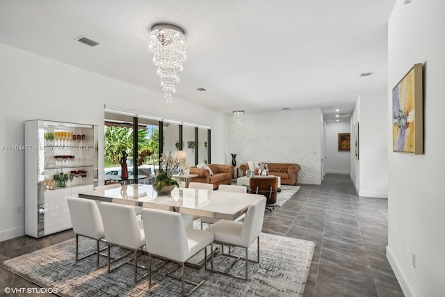 dining area with an inviting chandelier