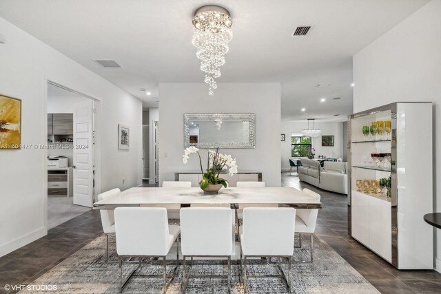 dining space with a chandelier