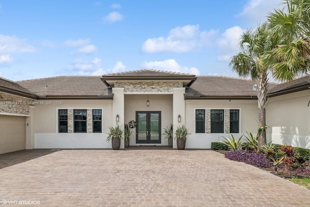 back of property with french doors