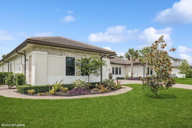 view of home's exterior featuring a yard