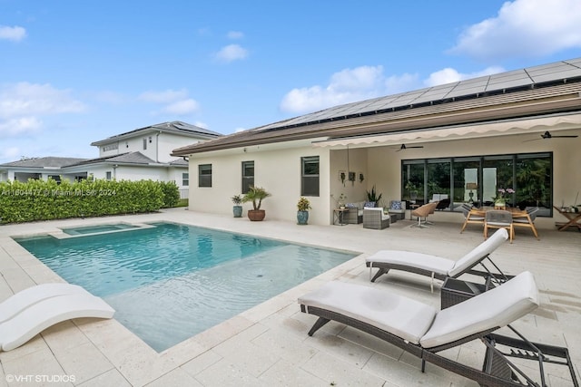 view of pool with outdoor lounge area, ceiling fan, and a patio area