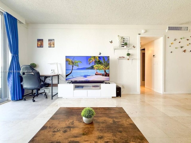 living room with a textured ceiling