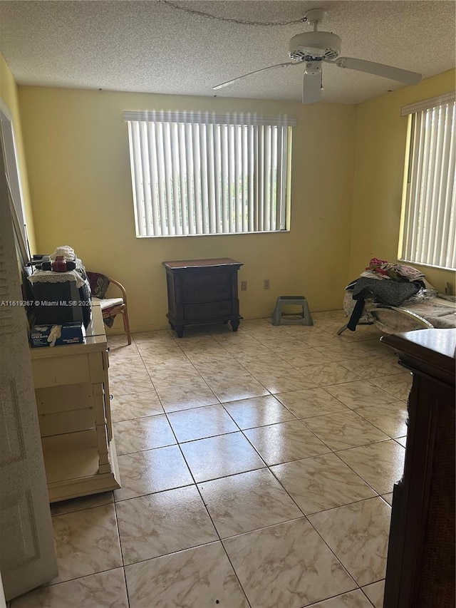 5945 Del Lago Cir Unit 201, Sunrise, FL 33313 - interior space with a ceiling fan and a textured ceiling