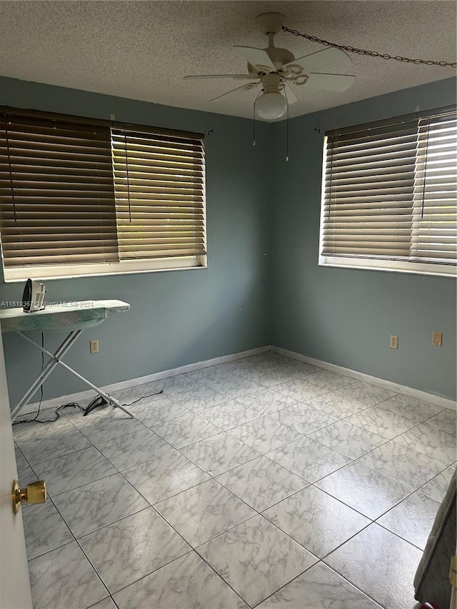 5945 Del Lago Cir Unit 201, Sunrise, FL 33313 - spare room featuring a ceiling fan and baseboards