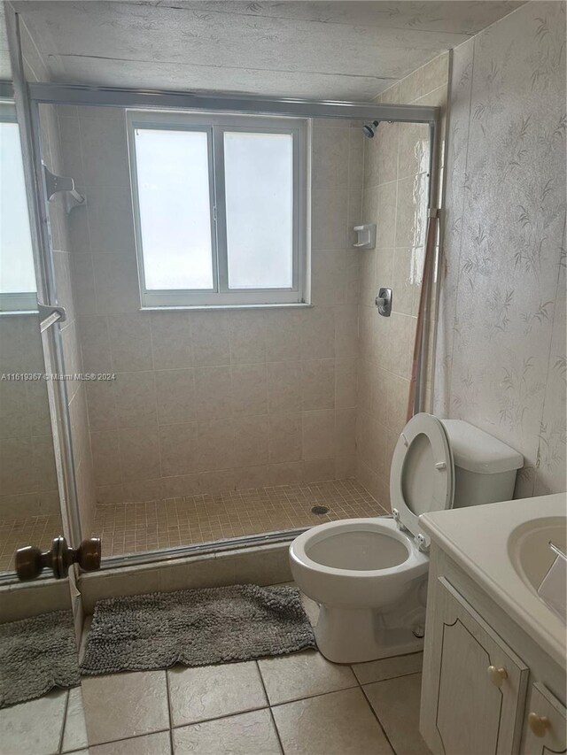 5945 Del Lago Cir Unit 201, Sunrise, FL 33313 - full bath featuring a shower stall, toilet, and vanity