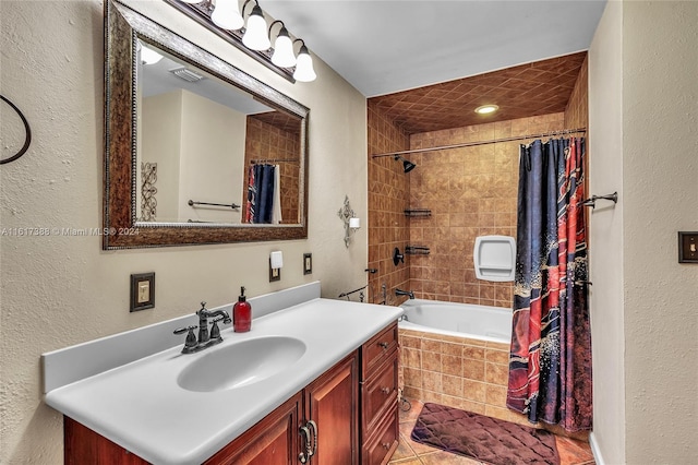 bathroom with vanity, shower / tub combo with curtain, and tile patterned floors