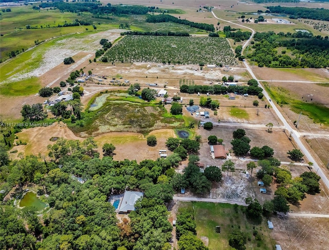 drone / aerial view featuring a rural view and a water view