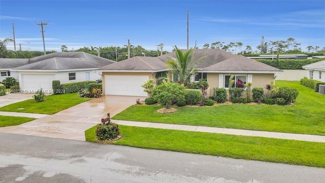 single story home featuring a garage, a front yard, concrete driveway, and cooling unit