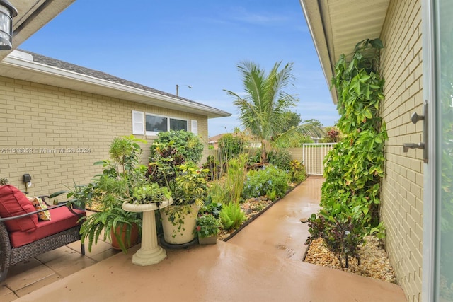 view of patio / terrace featuring fence