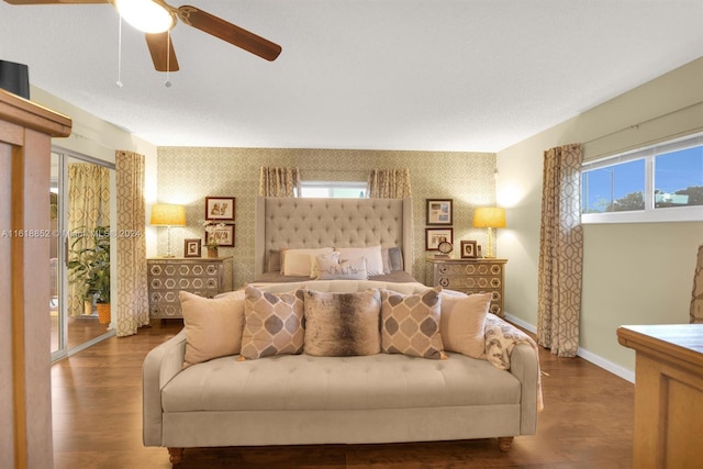 living room with dark hardwood / wood-style flooring and ceiling fan