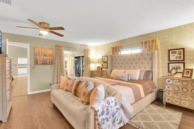 bedroom with ceiling fan and hardwood / wood-style flooring