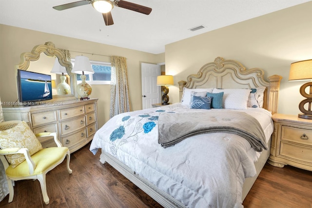 bedroom with dark wood-type flooring and ceiling fan