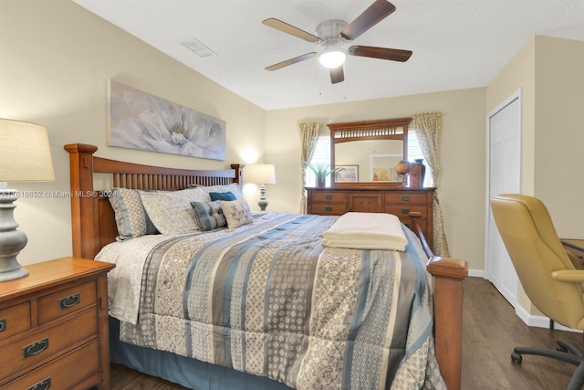 bedroom featuring dark hardwood / wood-style flooring and ceiling fan