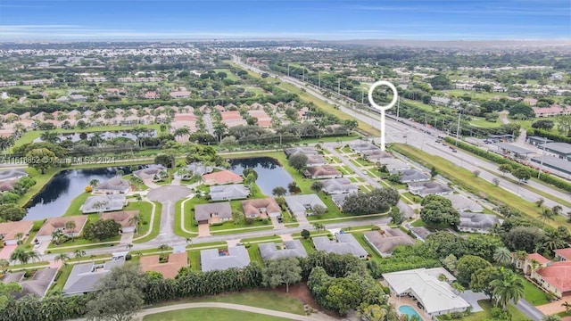 birds eye view of property with a residential view and a water view