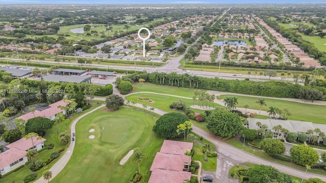 bird's eye view with view of golf course